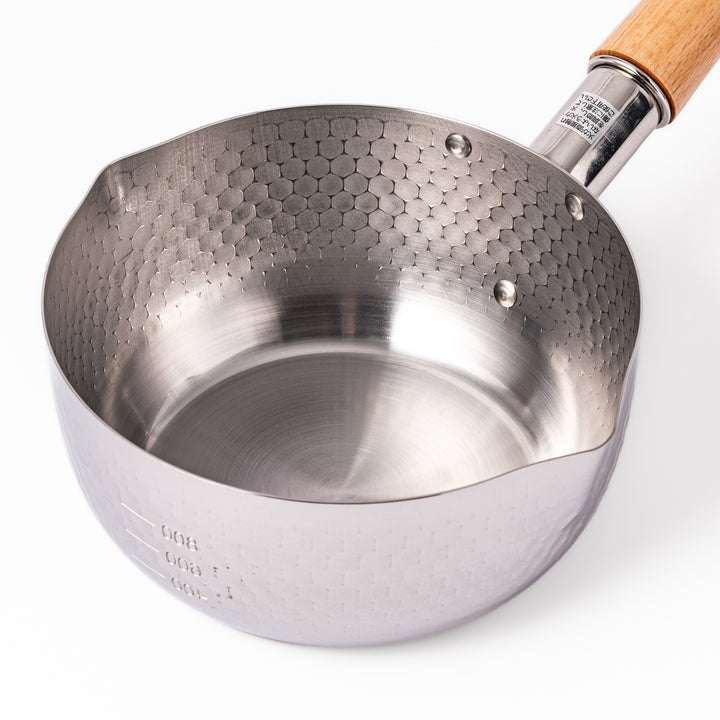 Japanese stainless steel Yukihira pot with a wooden handle and hammered finish, featuring twin pour spouts for easy cooking, simmering, and sauce preparation.