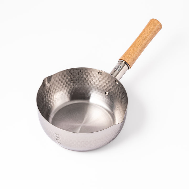 Stainless steel Yukihira pot with a wooden handle featuring a hammered texture and dual pour spouts, ideal for making soups, sauces, and everyday Japanese cooking.