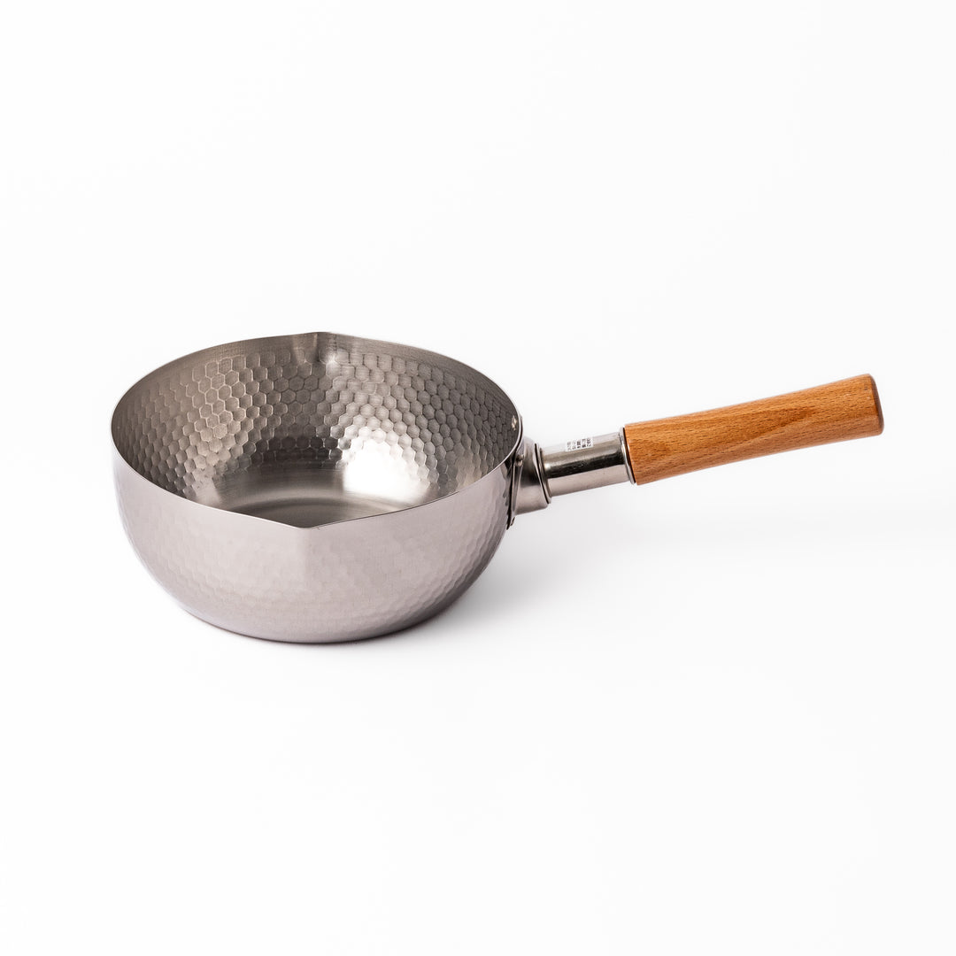 Japanese stainless steel Yukihira pot with a hammered finish and wooden handle, crafted for making soups, sauces, and simmered dishes with even heat distribution.