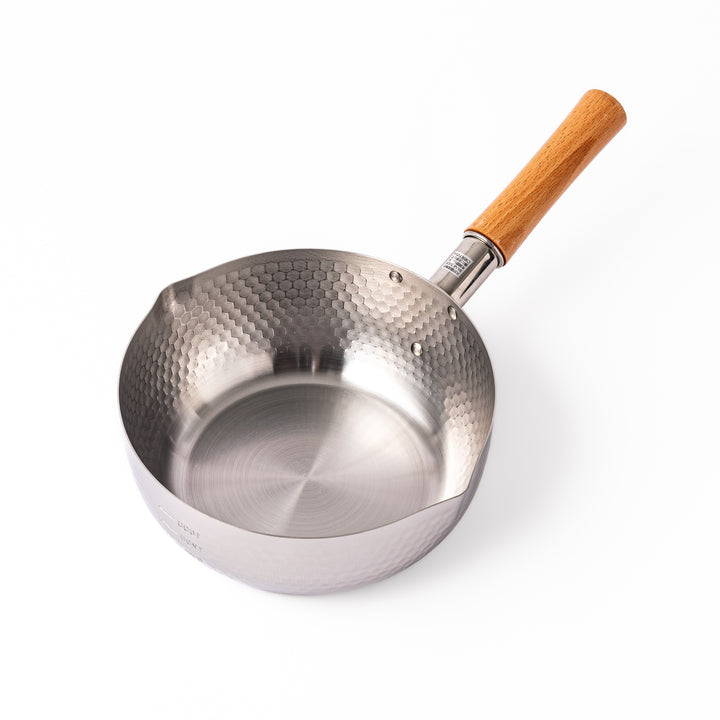 Japanese stainless steel Yukihira pot with a hammered finish and wooden handle, crafted for making soups, sauces, and simmered dishes with even heat distribution.