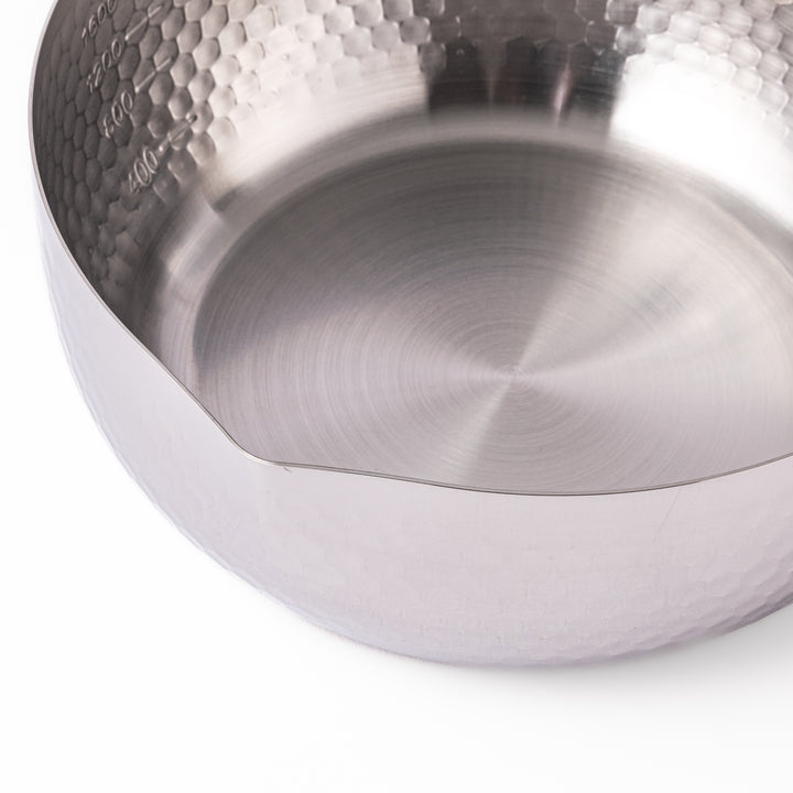 Japanese stainless steel Yukihira pot with a hammered finish and wooden handle, crafted for making soups, sauces, and simmered dishes with even heat distribution.