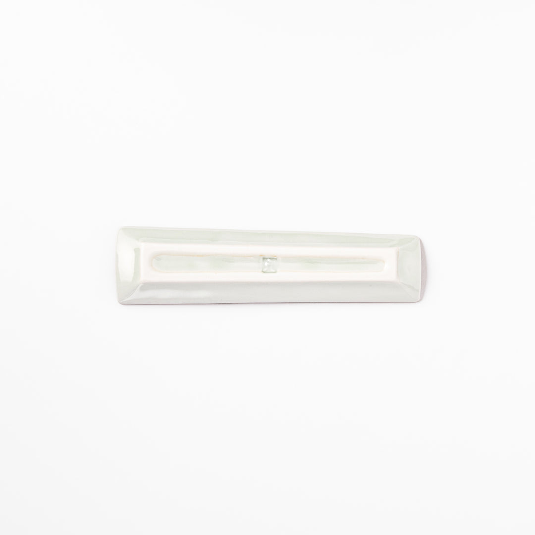 Japanese porcelain chopstick rest with whimsical China design featuring red pagoda, pandas, bamboo, and green tree accents