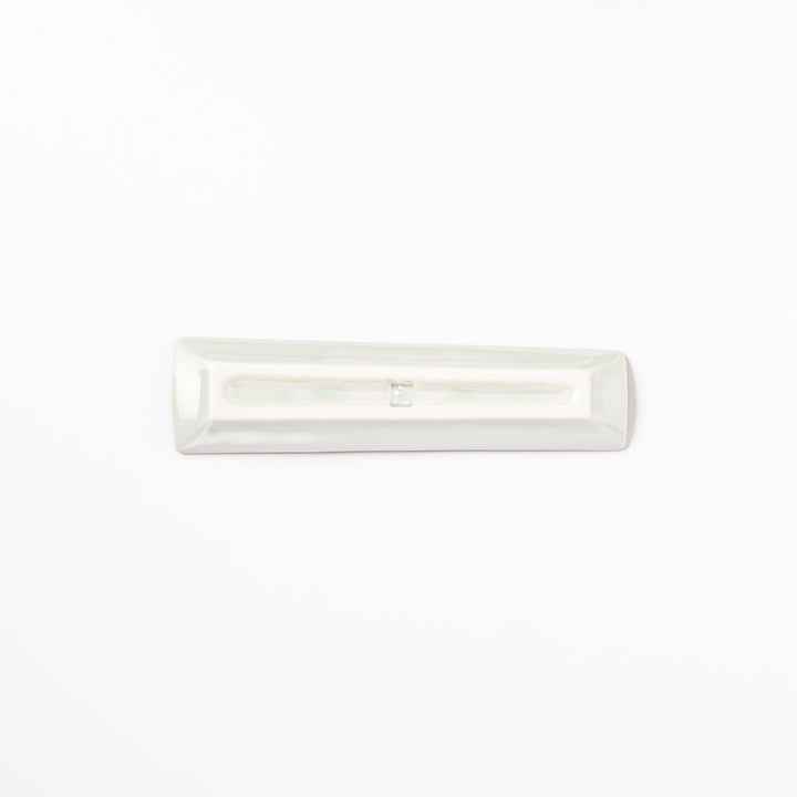 Japanese porcelain chopstick rest with whimsical China design featuring red pagoda, pandas, bamboo, and green tree accents