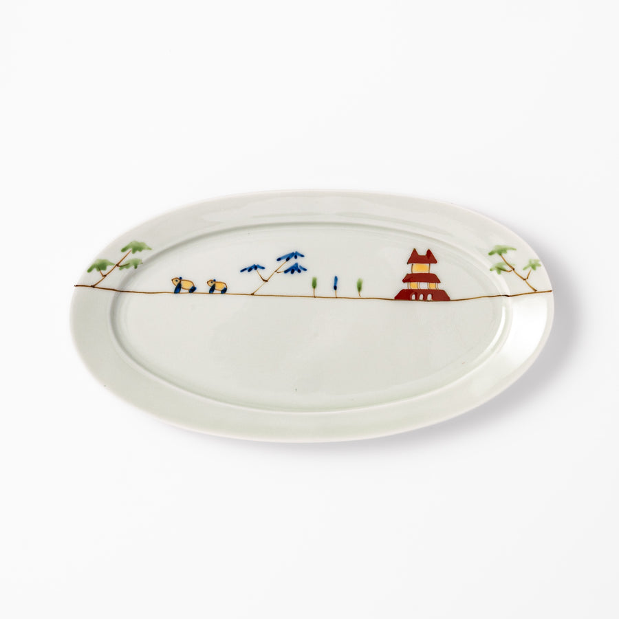 Japanese porcelain oval plate with whimsical China design featuring pandas, bamboo trees, and a traditional red pagoda