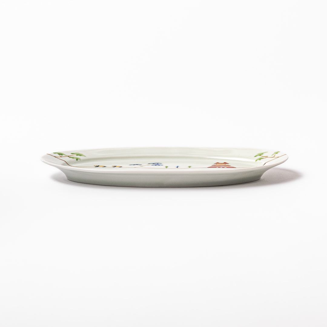 Japanese porcelain oval plate with whimsical China design featuring pandas, bamboo trees, and a traditional red pagoda