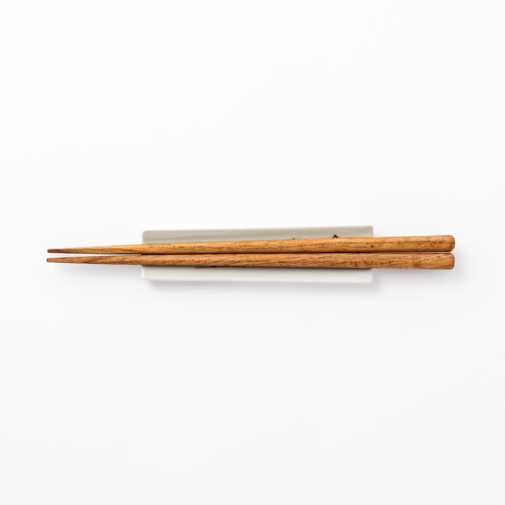Japanese porcelain chopstick rest with whimsical Egypt design featuring pyramid, camel, cactus, and colorful palm trees