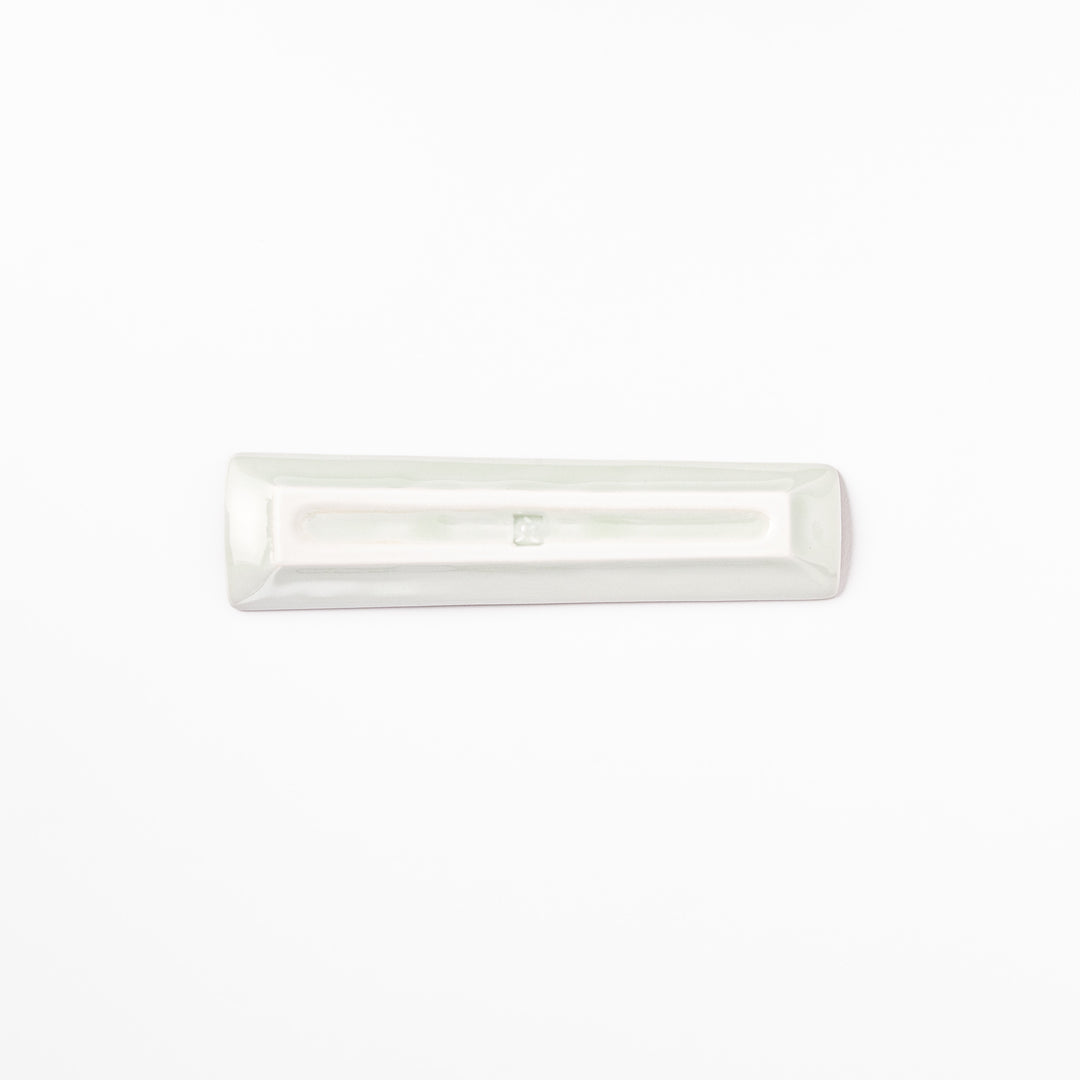 Japanese porcelain chopstick rest with whimsical Egypt design featuring pyramid, camel, cactus, and colorful palm trees