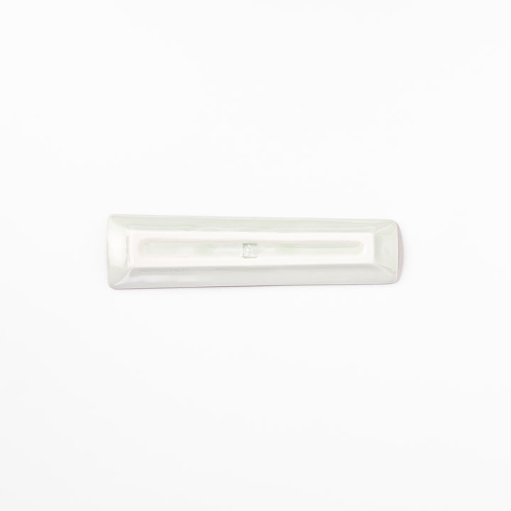 Japanese porcelain chopstick rest with whimsical Egypt design featuring pyramid, camel, cactus, and colorful palm trees