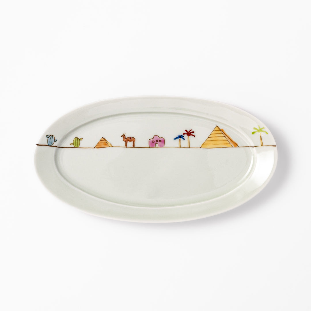 Japanese porcelain oval plate with whimsical Egypt design featuring pyramids, camel, palm trees, and desert-inspired details