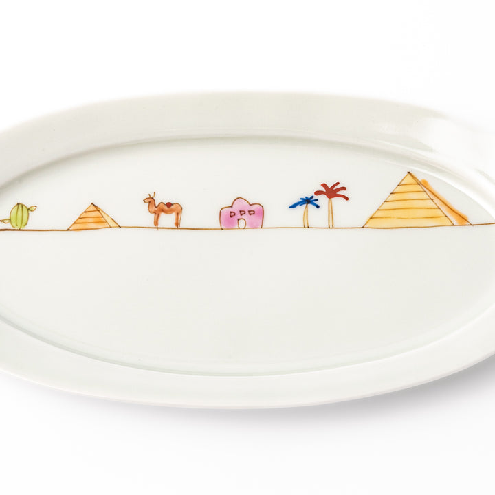 Japanese porcelain oval plate with whimsical Egypt design featuring pyramids, camel, palm trees, and desert-inspired details