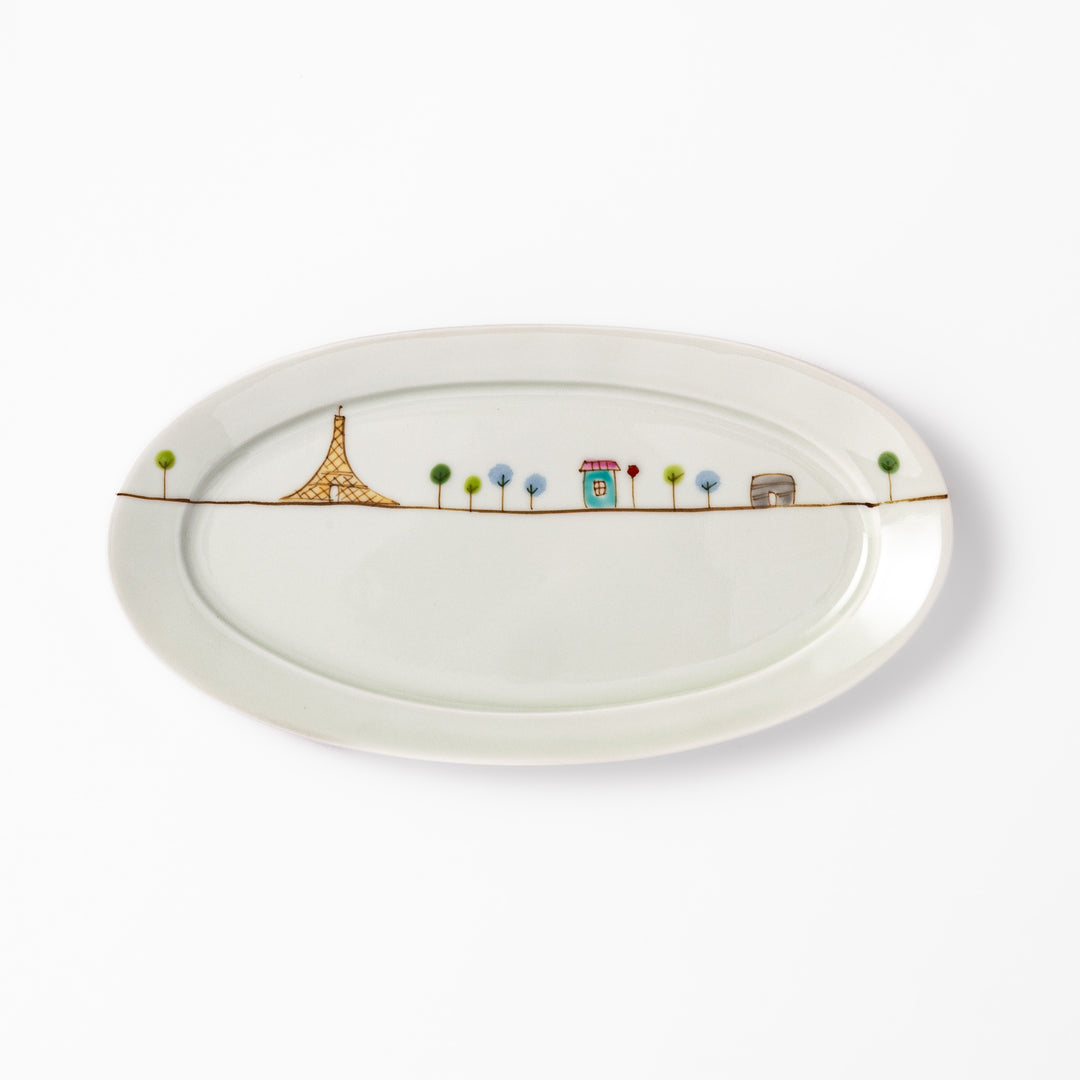 Japanese porcelain oval plate with whimsical France design featuring Eiffel Tower, Arc de Triomphe, trees, and colorful house