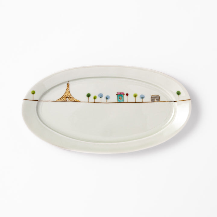 Japanese porcelain oval plate with whimsical France design featuring Eiffel Tower, Arc de Triomphe, trees, and colorful house