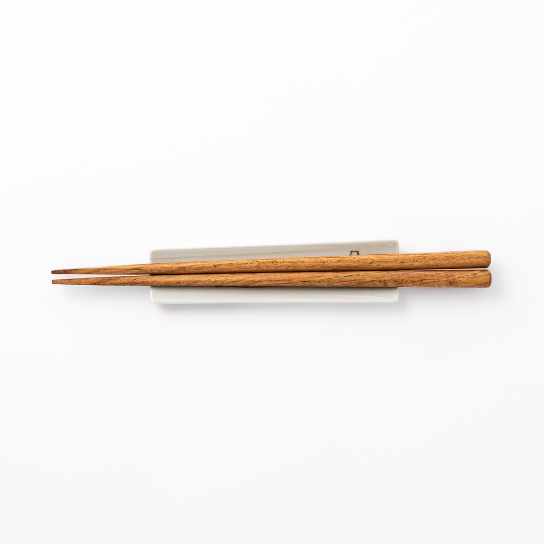 Japanese porcelain chopstick rest with whimsical Japan design featuring Mount Fuji, cherry blossoms, house, and colorful trees