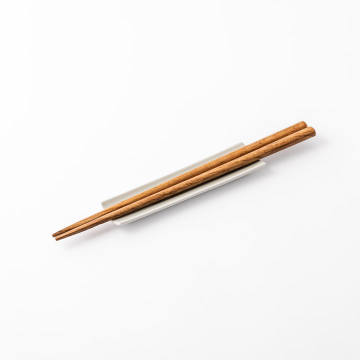 Japanese porcelain chopstick rest with whimsical Japan design featuring Mount Fuji, cherry blossoms, house, and colorful trees