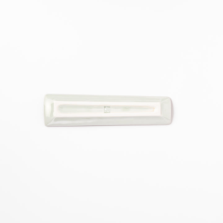 Japanese porcelain chopstick rest with whimsical Japan design featuring Mount Fuji, cherry blossoms, house, and colorful trees