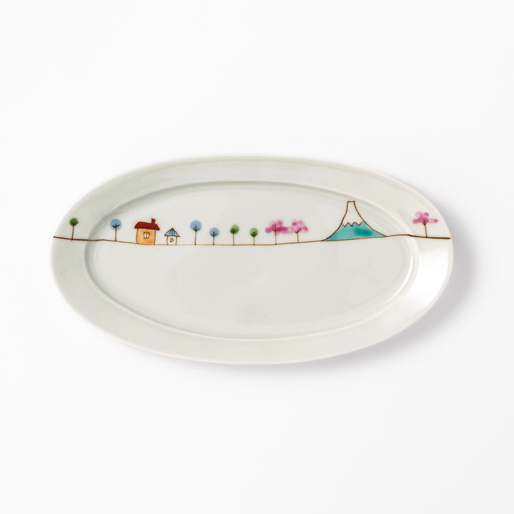 Japanese porcelain oval plate with whimsical Japan design featuring Mount Fuji, cherry blossoms, houses, and colorful trees