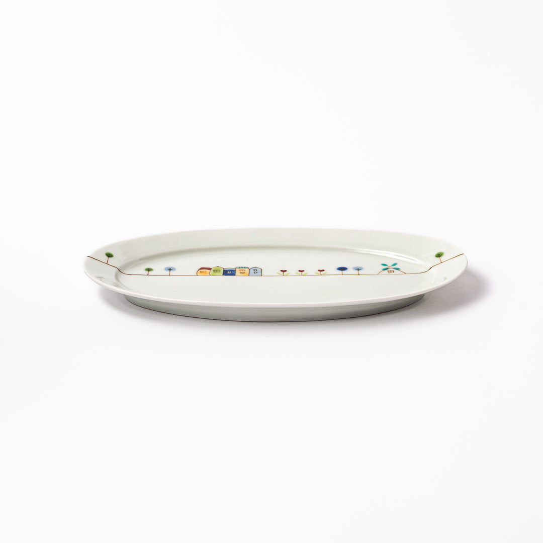 Japanese porcelain oval plate with whimsical Netherlands design featuring colorful houses, tulips, trees, and a blue windmill