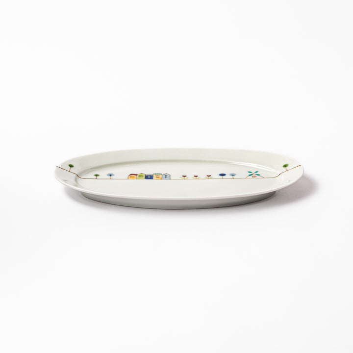 Japanese porcelain oval plate with whimsical Netherlands design featuring colorful houses, tulips, trees, and a blue windmill