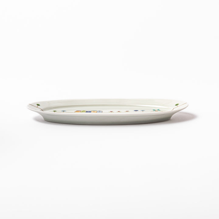 Japanese porcelain oval plate with whimsical Netherlands design featuring colorful houses, tulips, trees, and a blue windmill