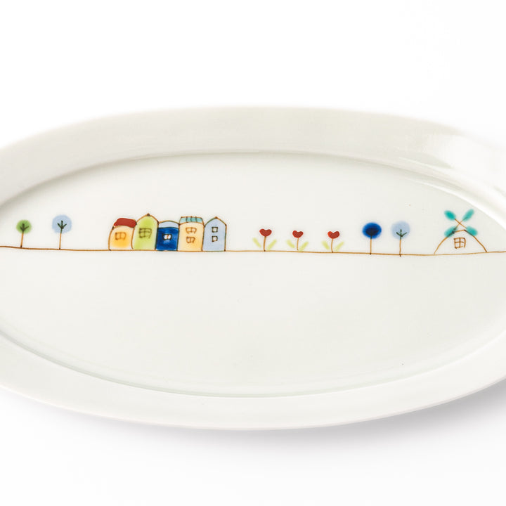 Japanese porcelain oval plate with whimsical Netherlands design featuring colorful houses, tulips, trees, and a blue windmill