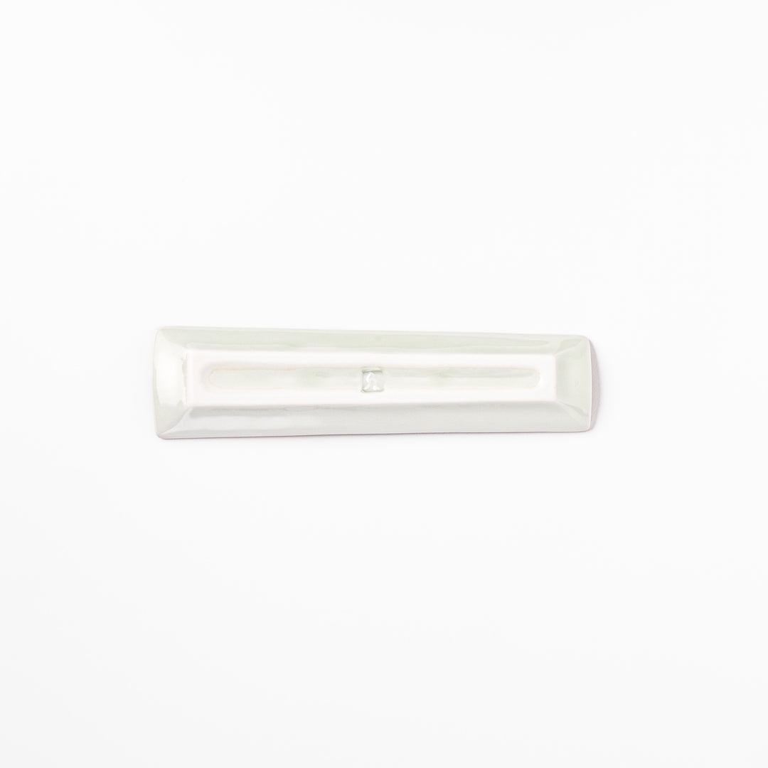 Japanese porcelain chopstick rest with USA design featuring Statue of Liberty, red bridge, and colorful cityscape accents