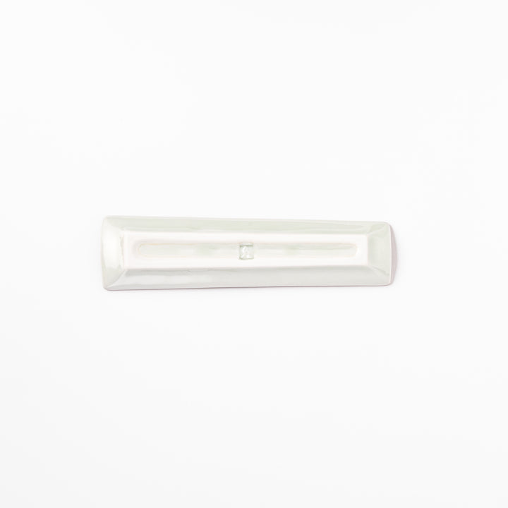 Japanese porcelain chopstick rest with USA design featuring Statue of Liberty, red bridge, and colorful cityscape accents