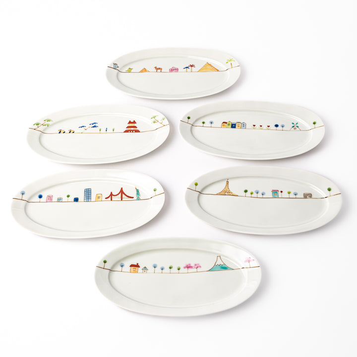 Set of six Japanese porcelain oval plates featuring colorful storybook-style world landmarks and whimsical travel-inspired designs