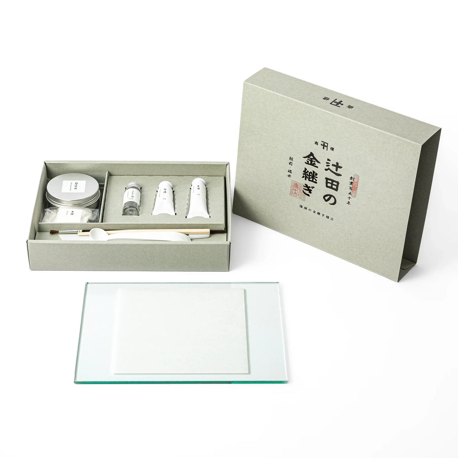 Open gift box of traditional Japanese kintsugi repair starter kit, showing the elegant packaging and art supplies