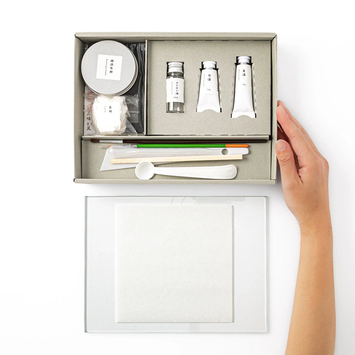 Traditional Japanese kintsugi repair starter kit neatly organized in a gift box, including genuine urushi and craft tools