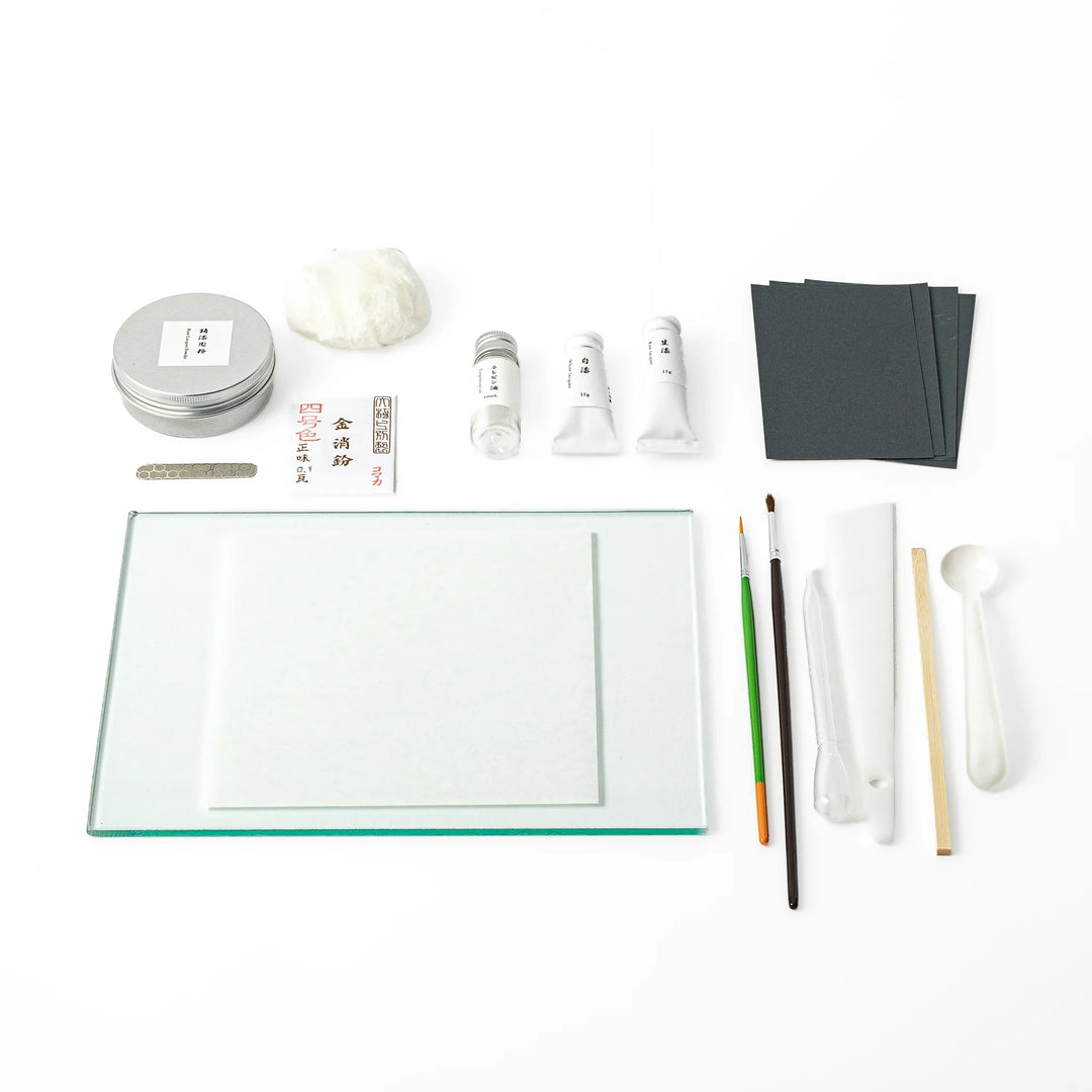 Traditional Japanese kintsugi repair starter kit, featuring authentic urushi lacquer gold powder and essential craft tools