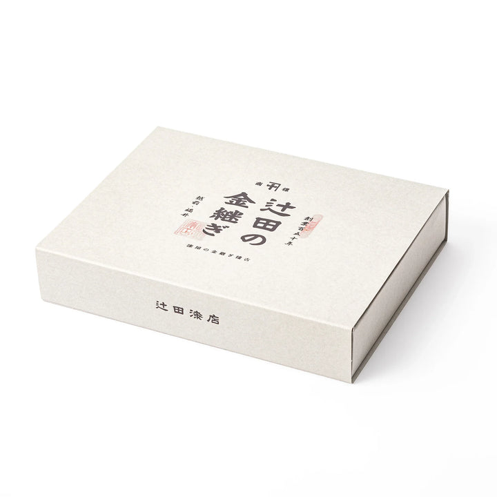 Elegant minimalist gift box package for the traditional Japanese kintsugi repair starter kit from a historic lacquer store