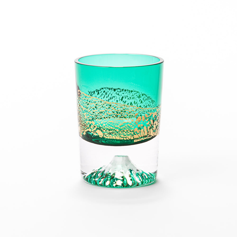 Green sake glass featuring intricate gold-leaf mountain scenery and a sculpted Mount Fuji at the base, combining elegance with Japanese artistry.