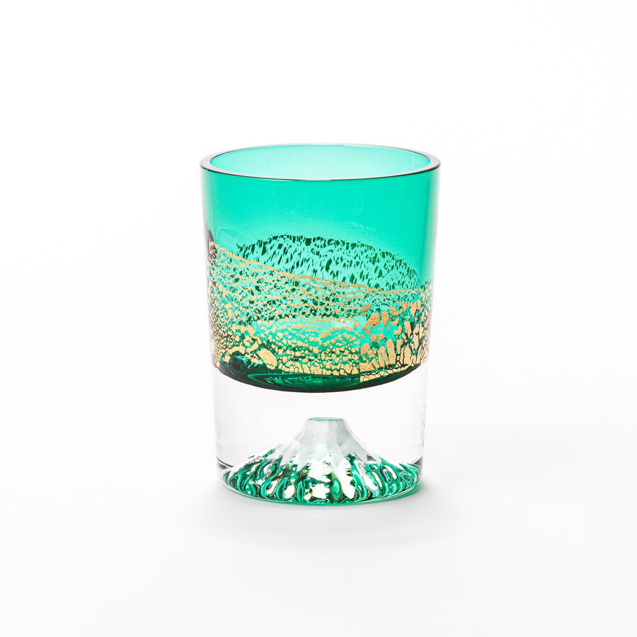 Green sake glass featuring intricate gold-leaf mountain scenery and a sculpted Mount Fuji at the base, combining elegance with Japanese artistry.