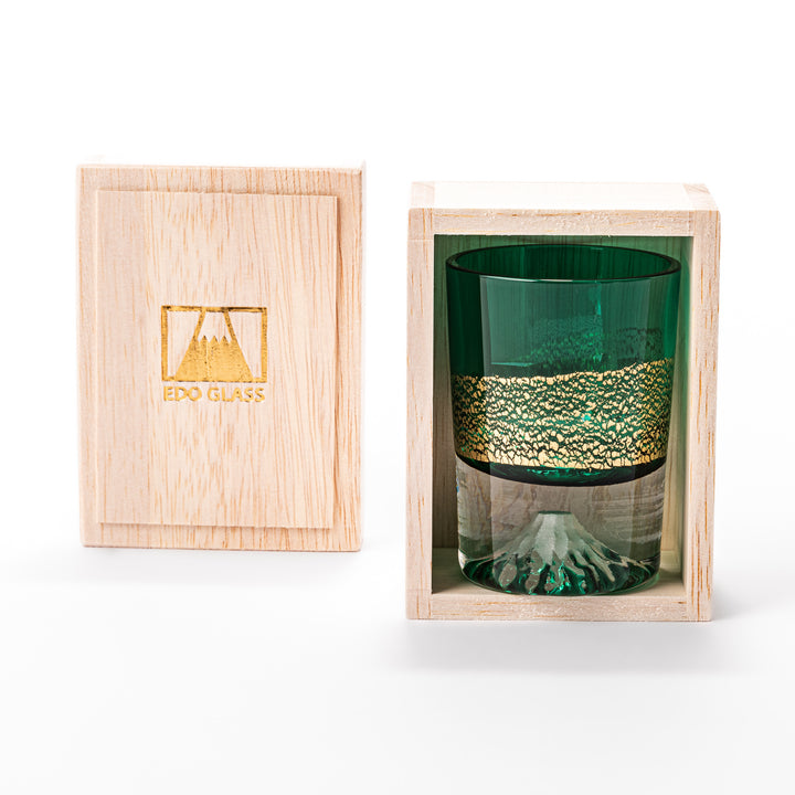 Green sake glass featuring intricate gold-leaf mountain scenery and a sculpted Mount Fuji at the base, combining elegance with Japanese artistry.