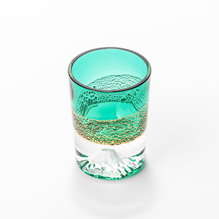 Green sake glass featuring intricate gold-leaf mountain scenery and a sculpted Mount Fuji at the base, combining elegance with Japanese artistry.