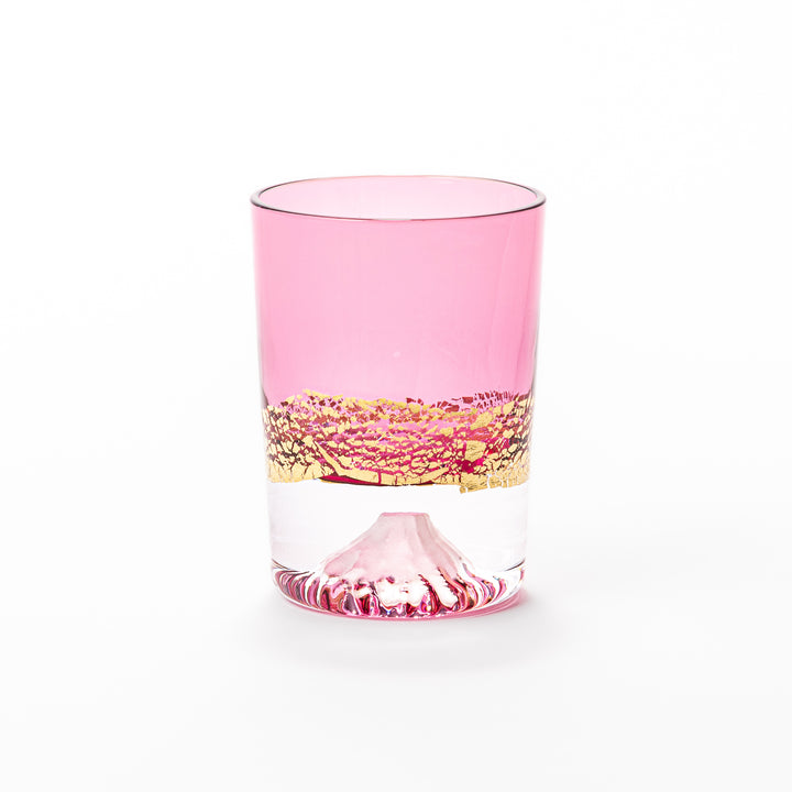 Pink sake glass with shimmering gold-leaf mountain design and a detailed Mount Fuji sculpted at the base, perfect for festive and elegant settings.