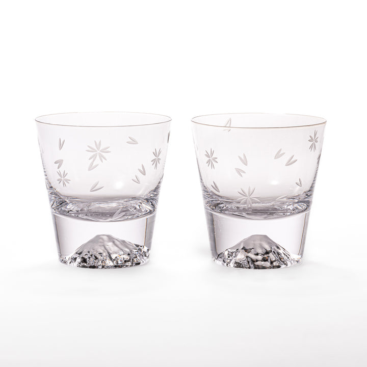 Pair of sakura-etched rocks glasses featuring a clear Mt. Fuji motif at the base, elegantly showcased for a stylish presentation.