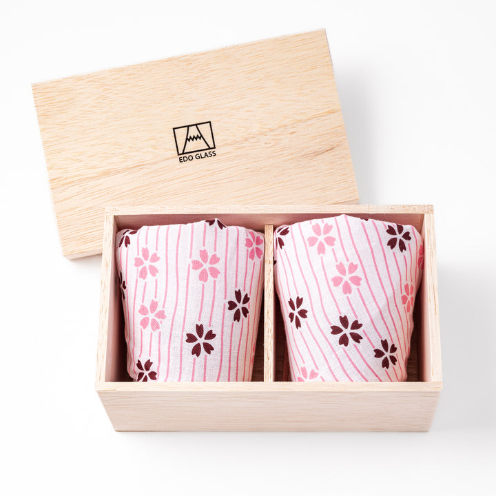 Pair of sakura-etched rocks glasses featuring a clear Mt. Fuji motif at the base, elegantly showcased for a stylish presentation.