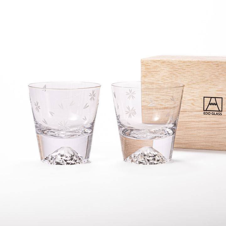 Pair of sakura-etched rocks glasses featuring a clear Mt. Fuji motif at the base, elegantly showcased for a stylish presentation.