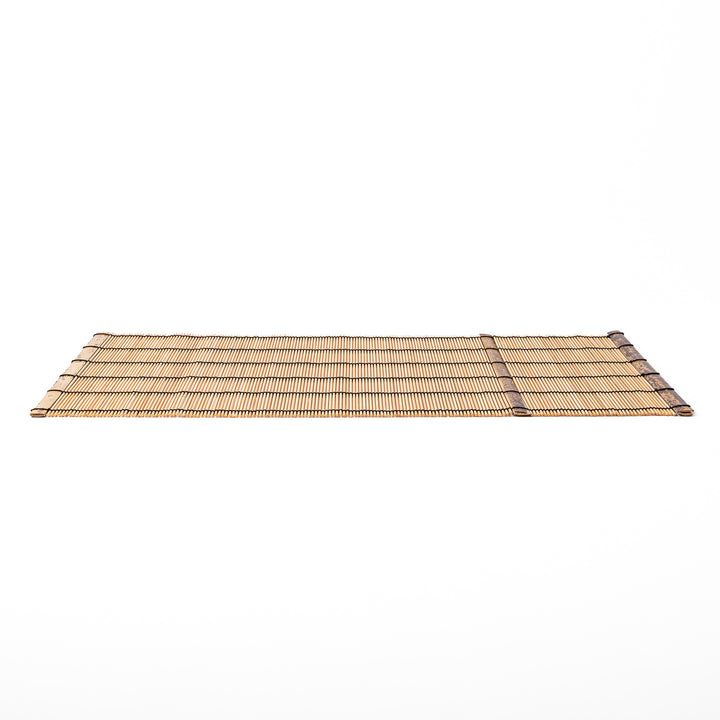 Japanese woven bamboo placemat in natural white tones with black thread accent for elegant dining table setup