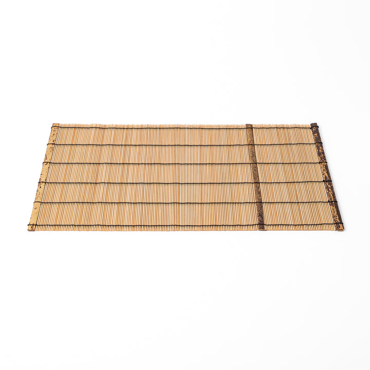 Japanese woven bamboo placemat in natural white tones with black thread accent for elegant dining table setup