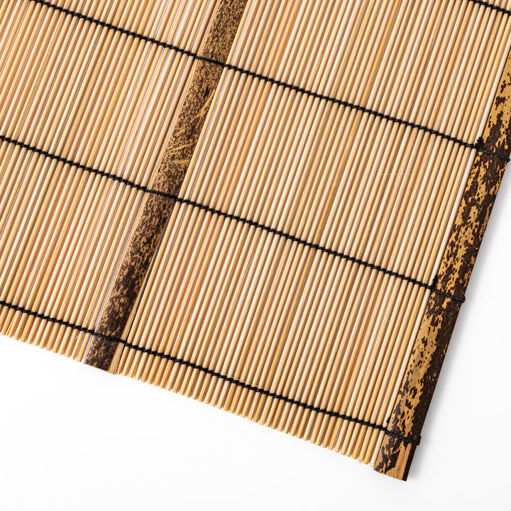 Japanese woven bamboo placemat in natural white tones with black thread accent for elegant dining table setup