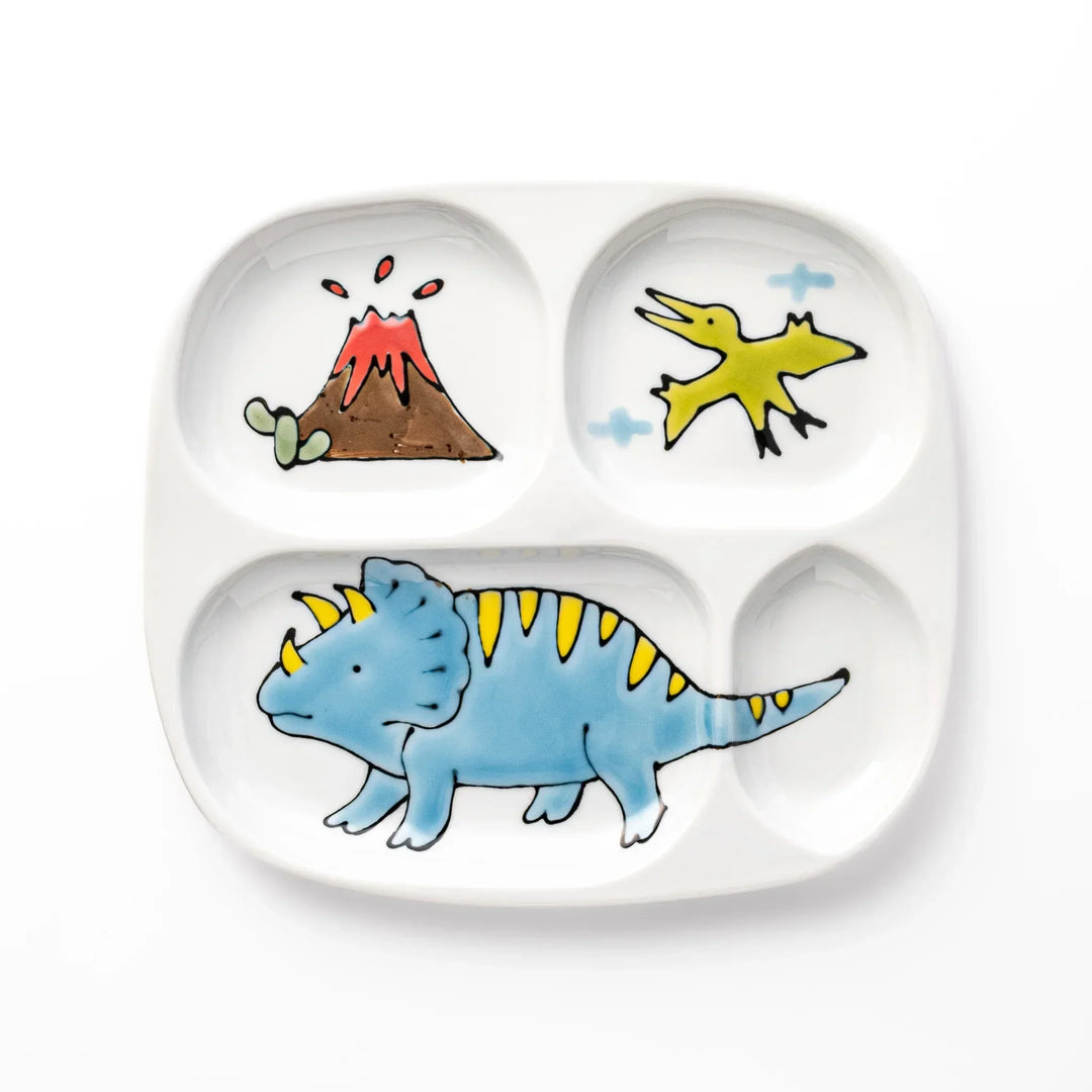 White ceramic kids divided plate with blue triceratops, yellow pterodactyl, red erupting volcano and blue cloud accents