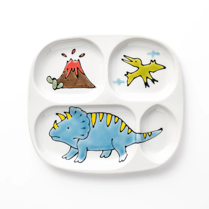White ceramic kids divided plate with blue triceratops, yellow pterodactyl, red erupting volcano and blue cloud accents