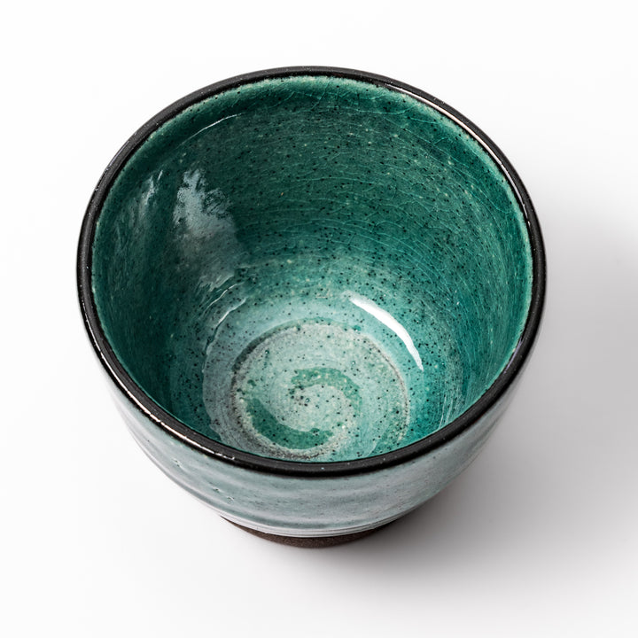 Turkish blue Japanese ceramic sake cup with rustic brown base and textured glaze, ideal for enjoying traditional sake