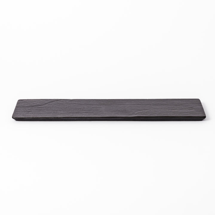 Rectangular black ceramic serving plate with a subtle ridged woodgrain texture, perfect for stylish Japanese meals and contemporary plating.