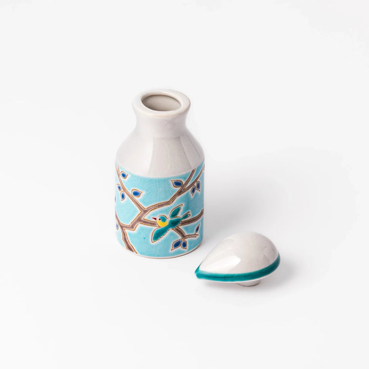 Japanese porcelain soy sauce dispenser with turquoise glaze and twin songbird motif on tree branches, handcrafted design.