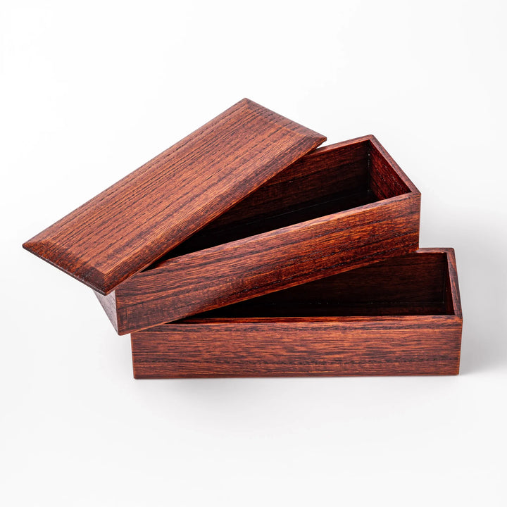 Rectangular two-tier bento box crafted from dark brown paulownia wood, showcasing a sleek grain pattern and a seamless, minimalist design.