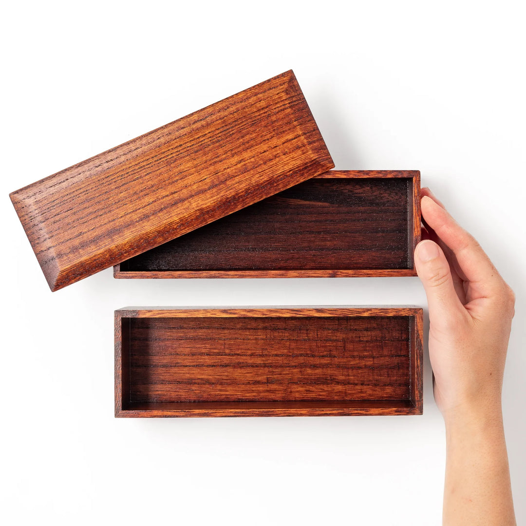Rectangular two-tier bento box crafted from dark brown paulownia wood, showcasing a sleek grain pattern and a seamless, minimalist design.