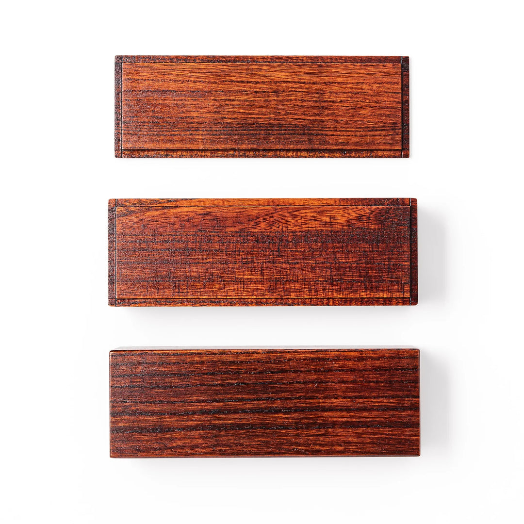 Rectangular two-tier bento box crafted from dark brown paulownia wood, showcasing a sleek grain pattern and a seamless, minimalist design.